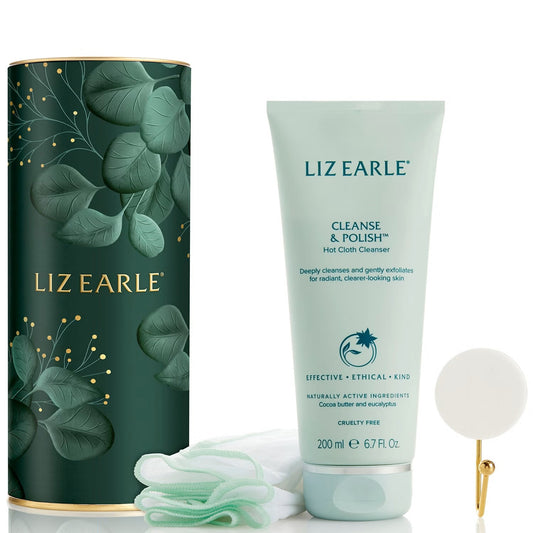 Liz Earle Cleanse & Polish hot cloth cleanser set, featuring a mint green squeeze tube, a dark green cylindrical box with gold and green leaf patterns, a white cotton cloth, and a small gold-handled applicator on a white background.