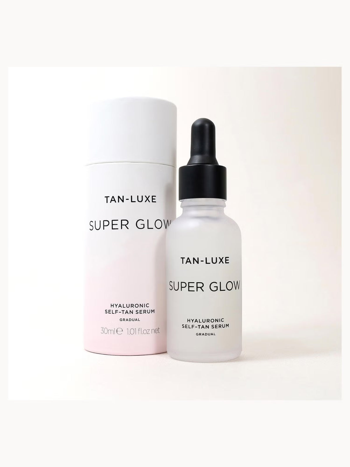 Tan-Luxe Super Glow Hyaluronic Self-Tan Serum 30ml bottle with a sleek design and pump dispenser for a natural sun-kissed glow.