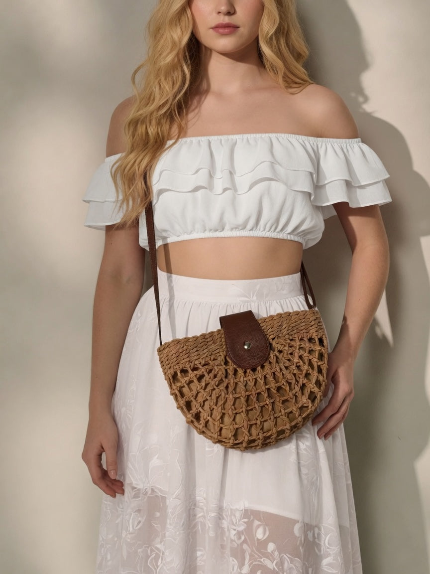 Natural straw half moon crossbody bag by Grace Beauty, women's raffia beach bag with adjustable strap and woven texture.