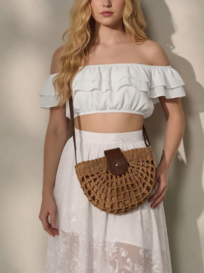 Natural straw half moon crossbody bag by Grace Beauty, women's raffia beach bag with adjustable strap and woven texture.