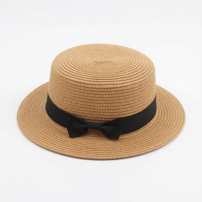 Grace Beauty woven raffia tote bag and straw hat set, perfect for travel and beach outings, featuring stylish woven straw design.