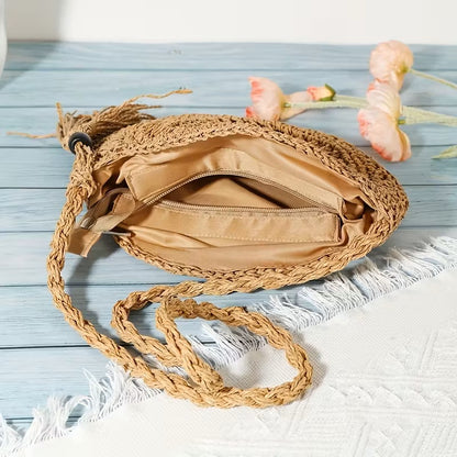 Handwoven fashion round hollow raffia shell crossbody shoulder bag by Grace Beauty, showing intricate woven design and shoulder strap.