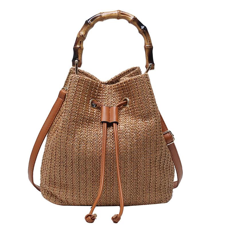 Women's vintage raffia bucket messenger handbag by Grace Beauty featuring woven raffia material and a casual, stylish design.