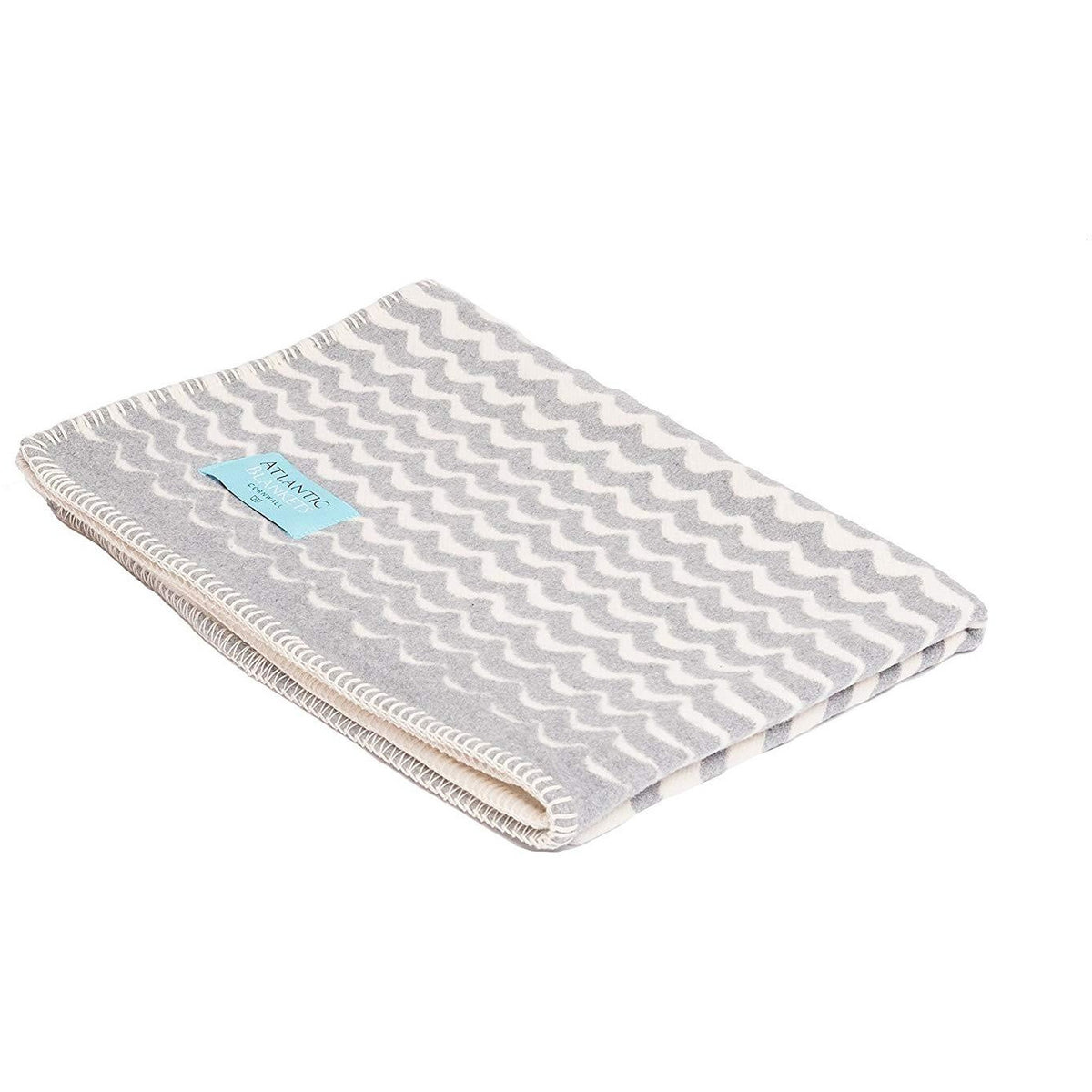 Grey Atlanta Sea Swell baby and child travel blanket, soft and cozy, suitable for kids on the go.